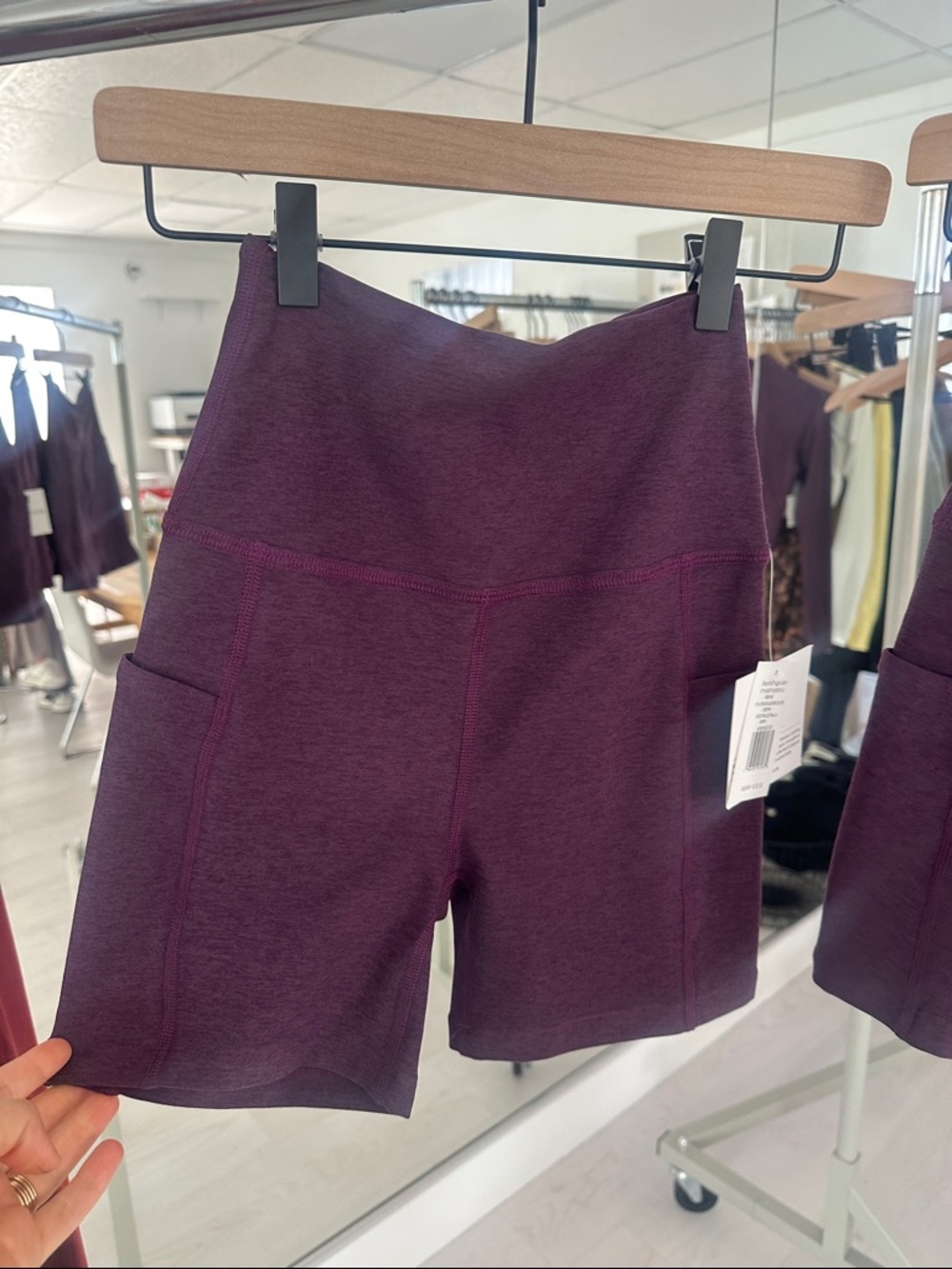Beyond Yoga High-Rise Pocket Bike Shorts in Deep Plum Heather